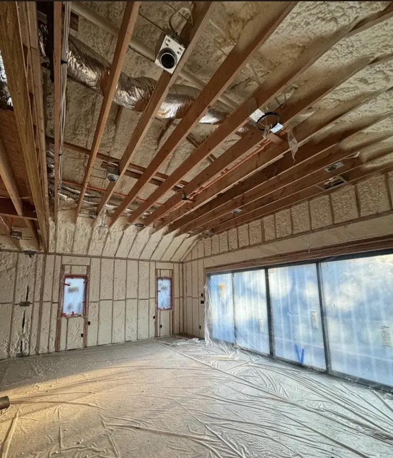 Interior walls and ceiling insulated with spray foam during new construction in Weston